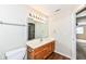 Bathroom with vanity, toilet and access to bedroom at 5921 Bastille Ln, Indianapolis, IN 46254