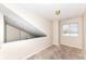 Spacious bedroom with carpeted floors and a window with blinds at 5921 Bastille Ln, Indianapolis, IN 46254
