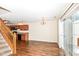 Dining area with hardwood floors, chandelier, and kitchen access at 5921 Bastille Ln, Indianapolis, IN 46254