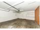 Spacious garage with overhead storage and pegboard wall at 5921 Bastille Ln, Indianapolis, IN 46254