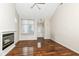 Living room features hardwood floors, fireplace, and sliding glass door access to patio at 5921 Bastille Ln, Indianapolis, IN 46254