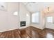 Living room with hardwood floors, fireplace, and vaulted ceiling at 5921 Bastille Ln, Indianapolis, IN 46254