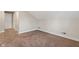 Empty carpeted bedroom with sloped ceiling, and access to hallway at 920 N Tacoma Ave, Indianapolis, IN 46201