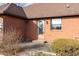 Brick home with a back patio and well-maintained landscaping at 11 Eastern Ave, Brownsburg, IN 46112