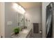 Modern bathroom with a sleek vanity, updated fixtures, and a stylish shower curtain at 11 Eastern Ave, Brownsburg, IN 46112