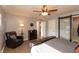 Main bedroom with black platform bed and a relaxing sitting area at 11 Eastern Ave, Brownsburg, IN 46112
