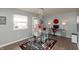 Bright dining area with glass table and modern chairs at 11 Eastern Ave, Brownsburg, IN 46112