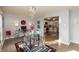 Bright dining room with glass table and modern chandelier at 11 Eastern Ave, Brownsburg, IN 46112