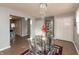 Bright dining area with a glass table, modern chairs, and hardwood floors at 11 Eastern Ave, Brownsburg, IN 46112