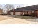 Brick duplex with attached garages and landscaped yards at 11 Eastern Ave, Brownsburg, IN 46112
