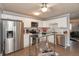 Modern kitchen with stainless steel appliances, white cabinets, and a glass-top island at 11 Eastern Ave, Brownsburg, IN 46112