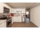 Stylish kitchen featuring stainless steel appliances and white cabinetry at 11 Eastern Ave, Brownsburg, IN 46112