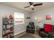 Comfortable sitting area with leather armchairs, hardwood floors, and decorative shelves at 11 Eastern Ave, Brownsburg, IN 46112