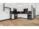 Modern kitchen with black and white cabinets and a stylish backsplash at 1125 California St, Columbus, IN 47201