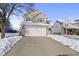 Two story house, white garage door, snow on ground at 11330 War Admiral Dr, Noblesville, IN 46060