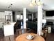 Open dining area with table and chairs, view to the living room at 11650 Laurel Springs Cir, Noblesville, IN 46060