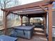 Hot tub on deck with pergola, providing a relaxing outdoor space at 11650 Laurel Springs Cir, Noblesville, IN 46060