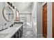 Modern bathroom with white subway tiles, frameless shower, and updated fixtures at 11725 Capistrano Dr, Indianapolis, IN 46236