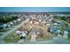An aerial shot shows an overview of the community and houses on a sunny day at 12216 Laurelwood Ct, Indianapolis, IN 46236