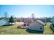 An aerial view of the home shows the spacious backyard and wooded surroundings at 12216 Laurelwood Ct, Indianapolis, IN 46236