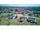 An aerial view shows the home nestled in a peaceful neighborhood with beautiful landscaping at 12216 Laurelwood Ct, Indianapolis, IN 46236