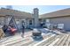 Large, inviting wooden deck with a grill, seating, and covered fire pit at 12216 Laurelwood Ct, Indianapolis, IN 46236
