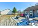 Picture of a spacious wooden deck with a swing, seating, and a covered fire pit at 12216 Laurelwood Ct, Indianapolis, IN 46236