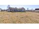 Wide view of an expansive backyard with a wooden deck at 12216 Laurelwood Ct, Indianapolis, IN 46236