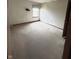 Spacious bedroom featuring neutral carpeting and a window with a decorative valance at 12216 Laurelwood Ct, Indianapolis, IN 46236