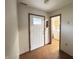 The entryway features a patterned floor, white door, and natural trim leading to a laundry room at 12216 Laurelwood Ct, Indianapolis, IN 46236