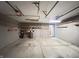 Three car garage with storage and utility lighting at 12216 Laurelwood Ct, Indianapolis, IN 46236