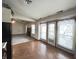 Charming kitchen with warm-toned cabinets and views of the yard through large glass doors at 12216 Laurelwood Ct, Indianapolis, IN 46236