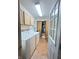 Well-equipped laundry room with washer, dryer, cabinets, and extra storage space at 12216 Laurelwood Ct, Indianapolis, IN 46236