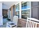 Front porch with rocking chairs and brick exterior at 1401 W Springhurst Blvd, Greenfield, IN 46140