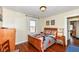 Cozy bedroom with hardwood floors and southwestern bedding at 152 N 3Rd Ave, Beech Grove, IN 46107