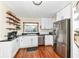 Modern kitchen with stainless steel appliances and dark countertops at 152 N 3Rd Ave, Beech Grove, IN 46107