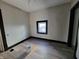 Bedroom with wood-look flooring and window at 2826 Station St, Indianapolis, IN 46218