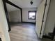 Simple bedroom with wood-look flooring and a window at 2826 Station St, Indianapolis, IN 46218