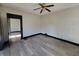Bright living room with hardwood floors and ceiling fan at 2826 Station St, Indianapolis, IN 46218