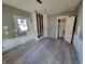 Simple bedroom with new flooring awaiting final touches at 2955 N Olney St, Indianapolis, IN 46218