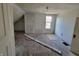 Unfinished attic bedroom with sloped ceilings and window at 2955 N Olney St, Indianapolis, IN 46218