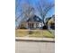 Charming two-story home with gray siding and a spacious front yard at 2955 N Olney St, Indianapolis, IN 46218