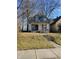 Recently renovated home with gray siding, steps, and a well-maintained lawn at 2955 N Olney St, Indianapolis, IN 46218