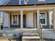 Renovated front porch with new door and windows, ready to enjoy at 2955 N Olney St, Indianapolis, IN 46218