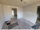 Unfinished living room with new flooring, high potential at 2955 N Olney St, Indianapolis, IN 46218