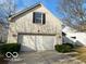 Brick house with a two-car garage and landscaping at 3660 Cedar Pine Pl, Indianapolis, IN 46235