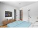 Bright bedroom featuring a comfortable bed, stylish furnishings, and closet space at 3830 Pineview Ln, Greenwood, IN 46142