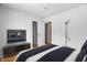 Bedroom with a dark-blue bedding set and mirrored TV at 3830 Pineview Ln, Greenwood, IN 46142