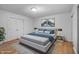 Serene bedroom offers a comfortable bed, minimalist decor, and a double door closet at 3830 Pineview Ln, Greenwood, IN 46142