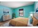Bedroom with teal walls and a cozy bed setup at 3830 Pineview Ln, Greenwood, IN 46142